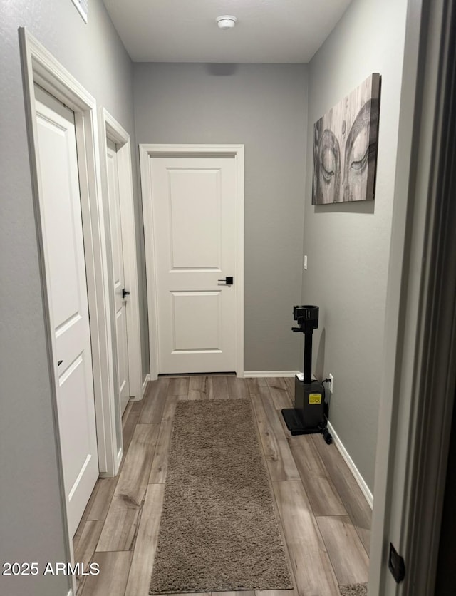 1418 E Jacqueline Pl, Casa Grande, AZ 85122 - hall featuring light wood finished floors and baseboards