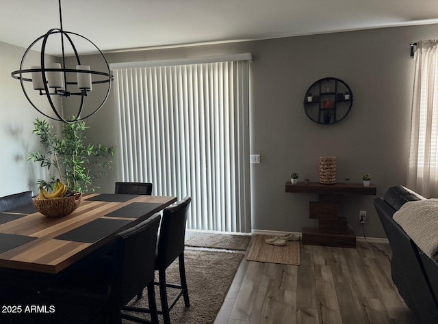 1418 E Jacqueline Pl, Casa Grande, AZ 85122 - dining area with a chandelier, wood finished floors, and baseboards