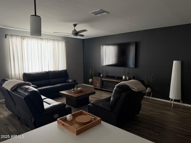 1418 E Jacqueline Pl, Casa Grande, AZ 85122 - living room featuring wood finished floors, baseboards, and ceiling fan