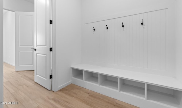 mudroom featuring baseboards and light wood-type flooring