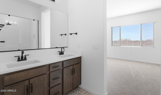 bathroom featuring vanity and a tile shower