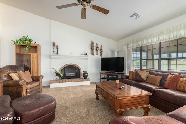 carpeted living room featuring lofted ceiling, ceiling fan, and a brick fireplace