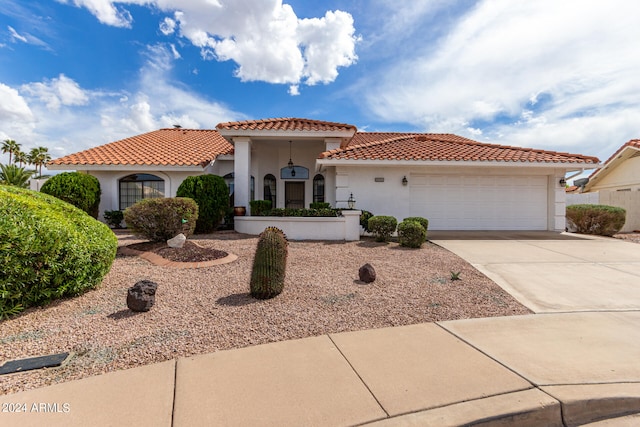 mediterranean / spanish-style house featuring a garage