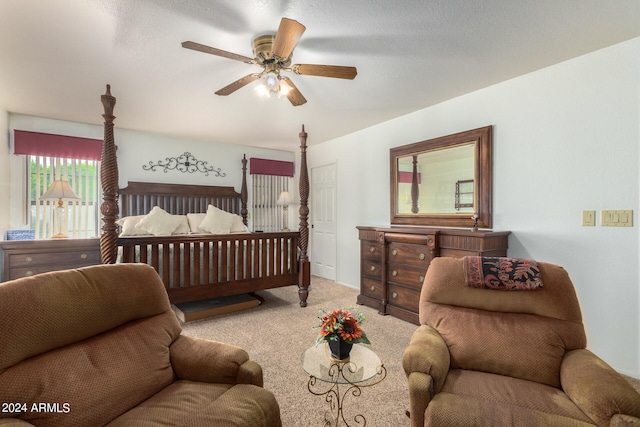 bedroom featuring light carpet and ceiling fan