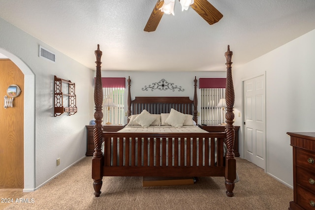 bedroom with light carpet and ceiling fan