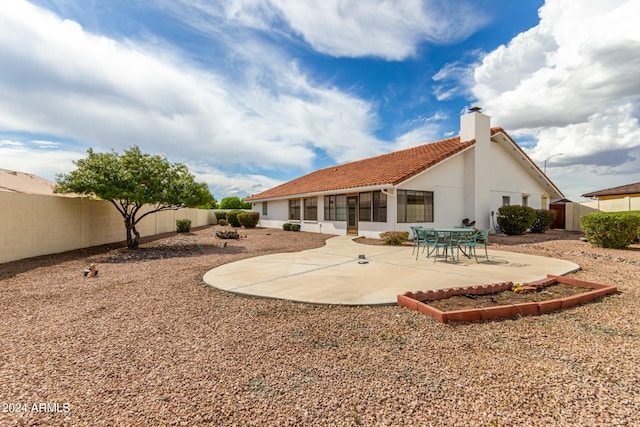 back of property featuring a patio area