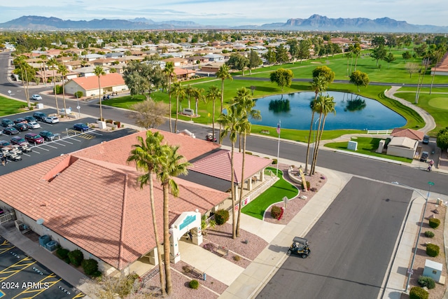 drone / aerial view featuring a water and mountain view