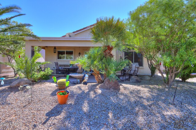 back of house with a patio