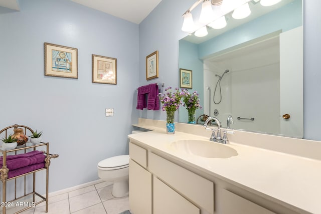 bathroom featuring vanity, a shower, toilet, and tile patterned flooring