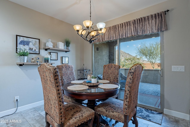 dining area featuring a chandelier