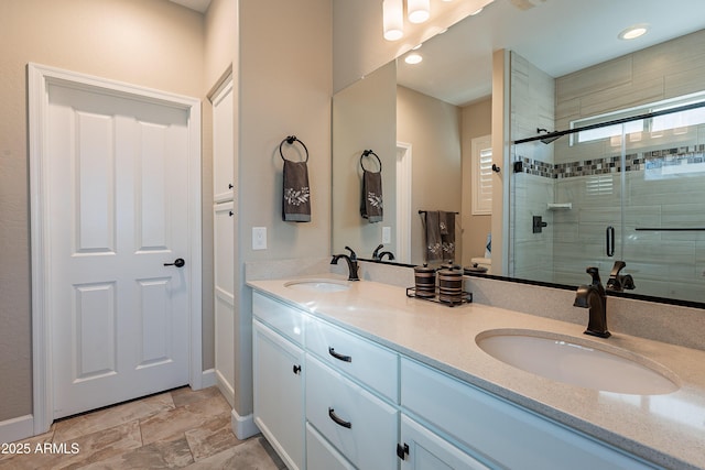 bathroom with vanity and an enclosed shower