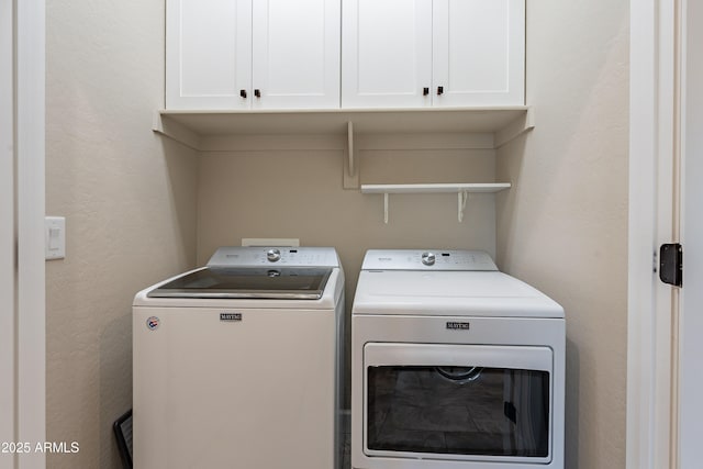 washroom with cabinets and independent washer and dryer