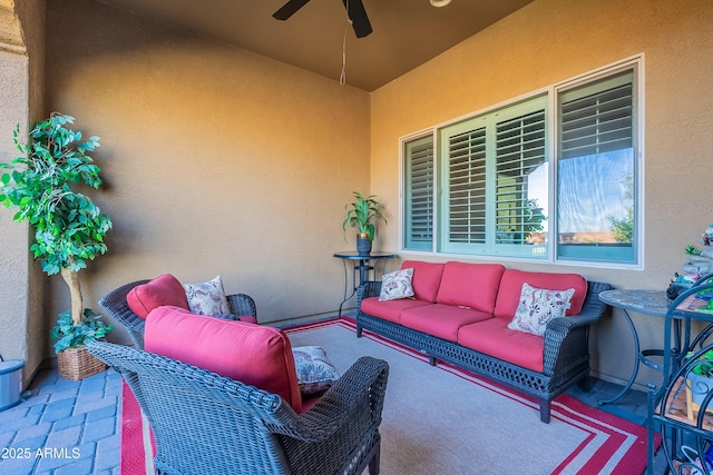 view of patio with ceiling fan and an outdoor hangout area