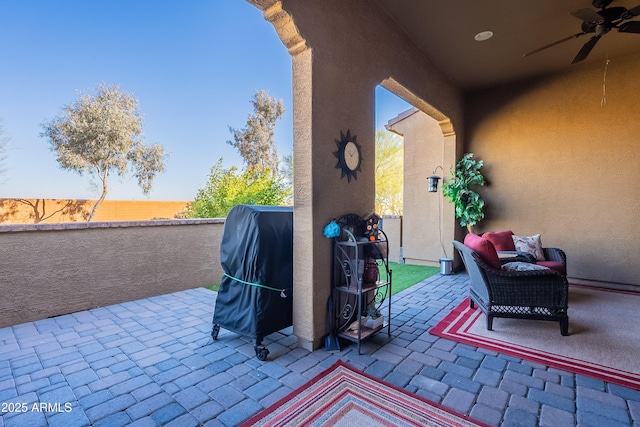 view of patio / terrace with area for grilling and ceiling fan