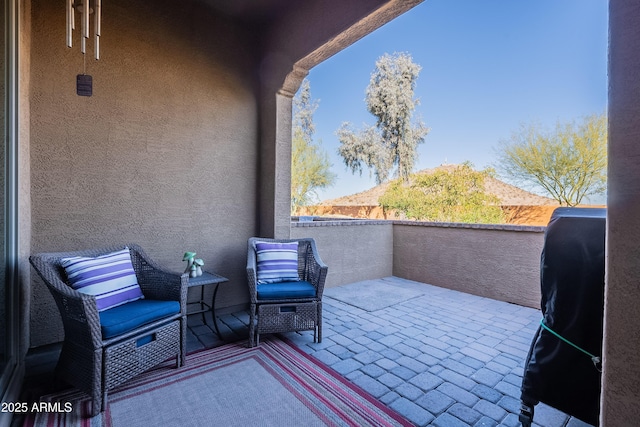 balcony with a patio area and grilling area