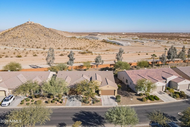 birds eye view of property with a mountain view