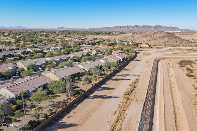 birds eye view of property featuring a mountain view