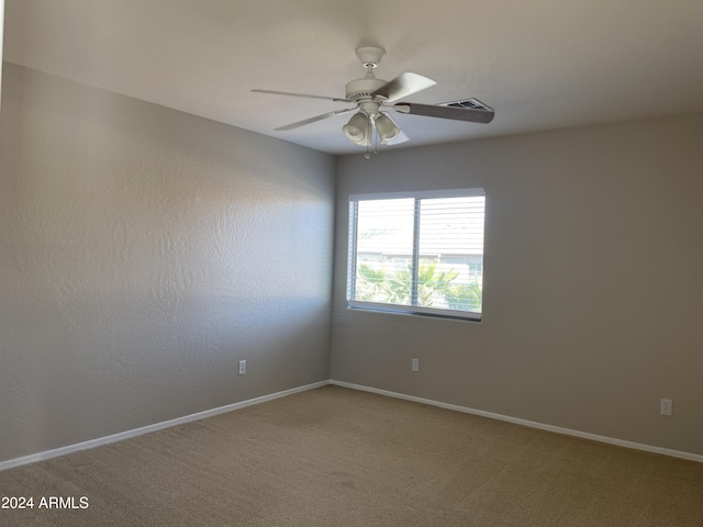 carpeted empty room with ceiling fan