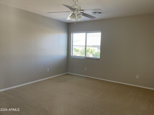 unfurnished room featuring carpet flooring and ceiling fan