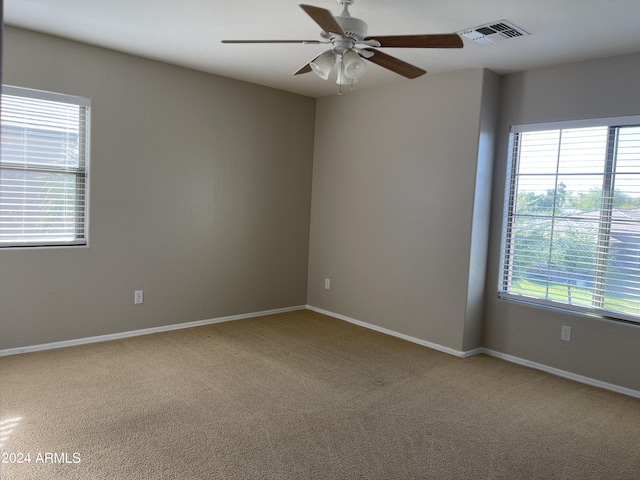 unfurnished room featuring carpet and ceiling fan