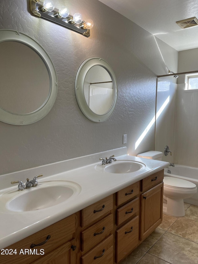 full bathroom with tile patterned floors, vanity, toilet, and shower / tub combination