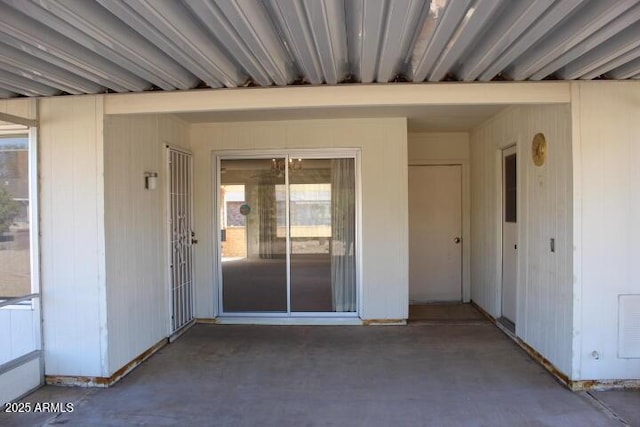 entrance to property featuring a patio