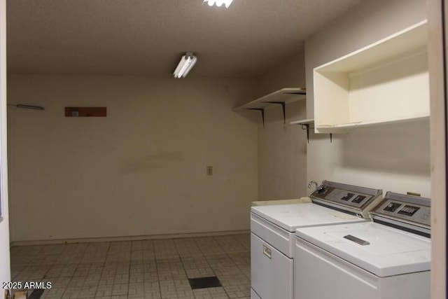 clothes washing area featuring washer and clothes dryer