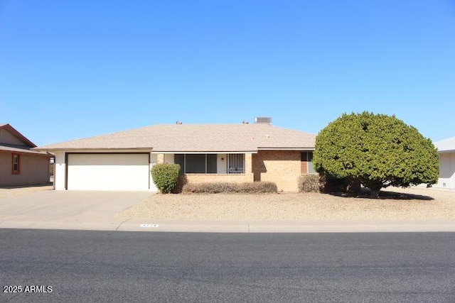 ranch-style house featuring a garage