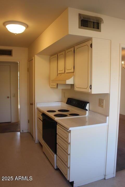 kitchen with white cabinetry and white electric stove