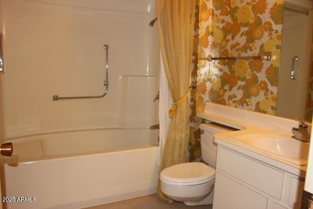 full bathroom featuring washtub / shower combination, vanity, and toilet