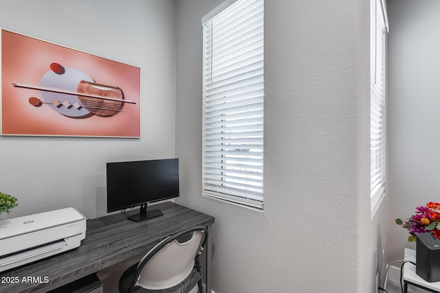 home office featuring a textured wall
