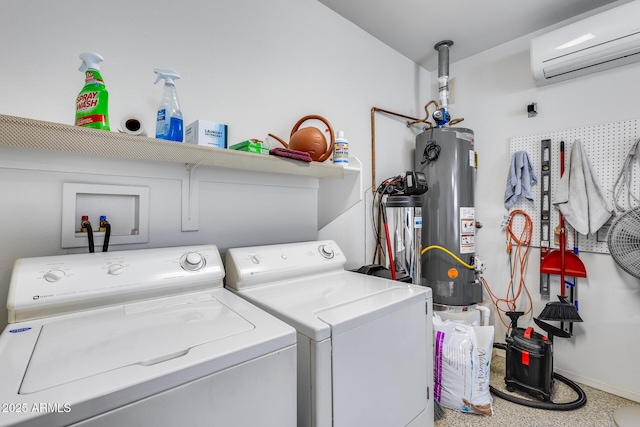 clothes washing area featuring laundry area, a wall unit AC, gas water heater, baseboards, and washer and dryer