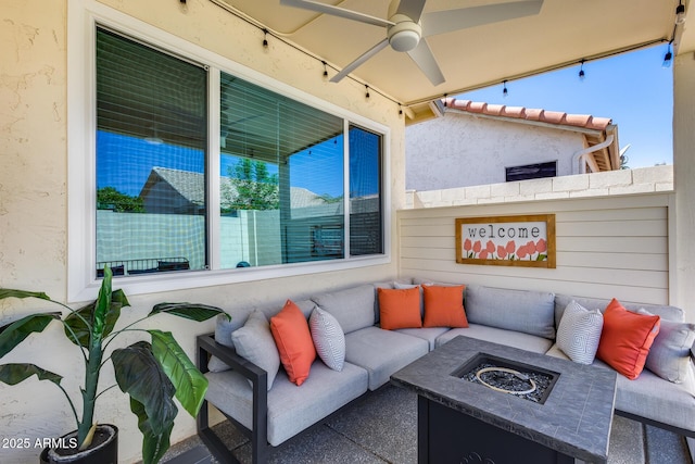 view of patio / terrace with an outdoor living space with a fire pit and a ceiling fan