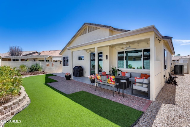 rear view of house featuring a ceiling fan, a fenced backyard, central AC, stucco siding, and a patio