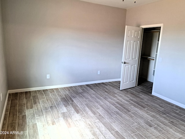 spare room with hardwood / wood-style floors