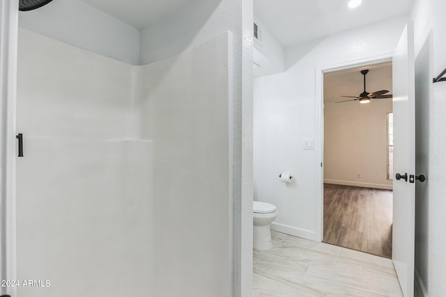 bathroom with toilet and ceiling fan