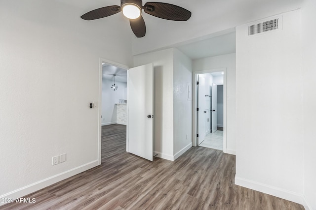 unfurnished room featuring hardwood / wood-style flooring and ceiling fan