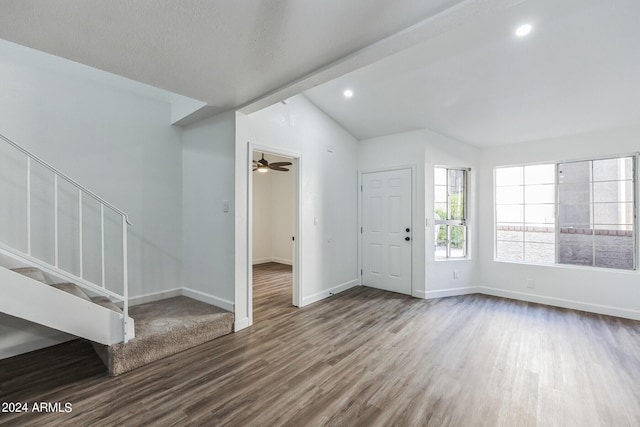 entryway with ceiling fan, hardwood / wood-style floors, and lofted ceiling