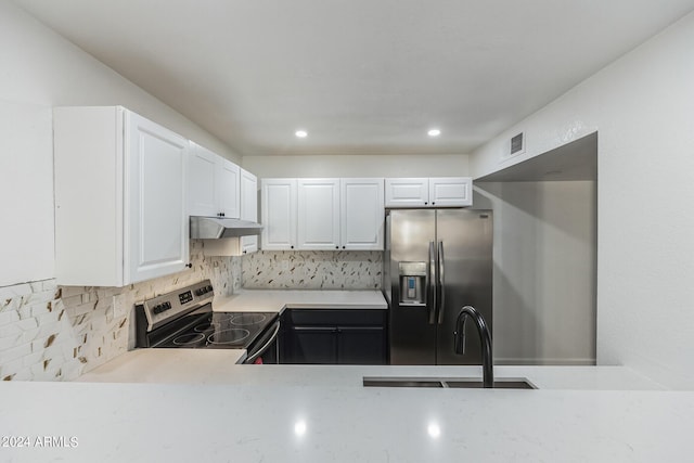 kitchen with sink, white cabinetry, backsplash, and appliances with stainless steel finishes