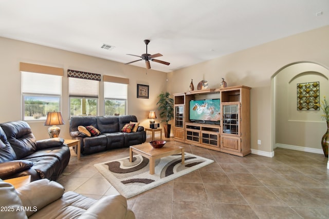 living room with light tile patterned floors and ceiling fan