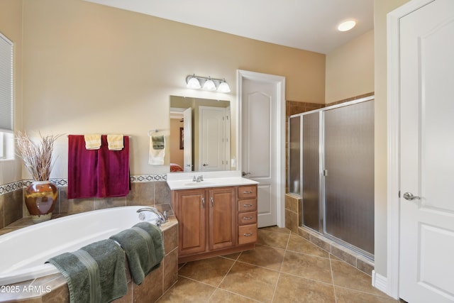 bathroom featuring vanity, tile patterned floors, and shower with separate bathtub