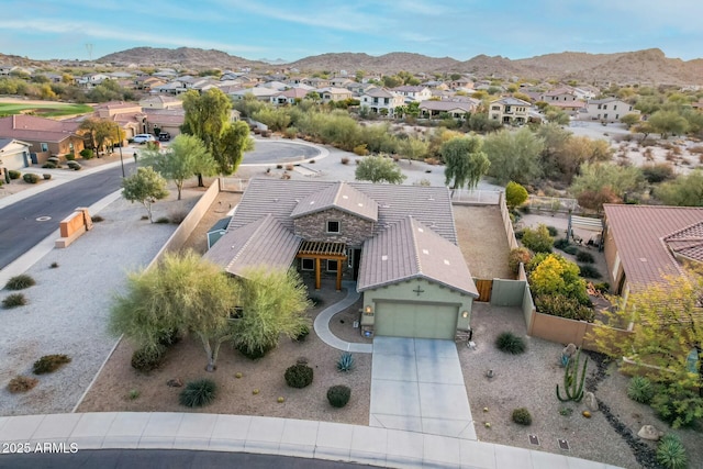 birds eye view of property featuring a mountain view