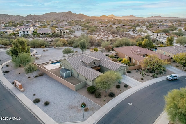 birds eye view of property with a mountain view