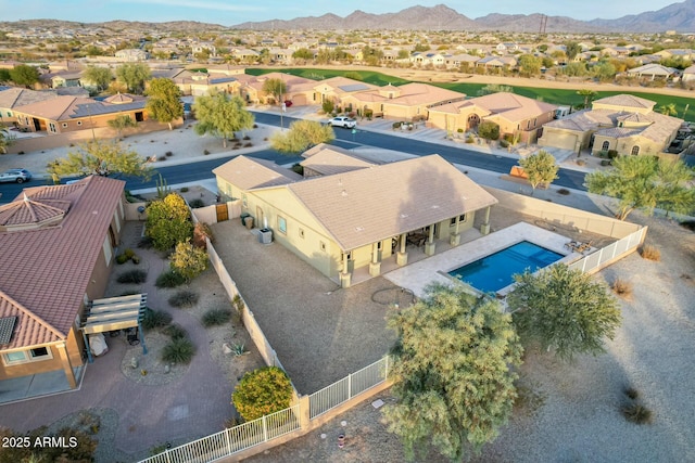 birds eye view of property with a mountain view