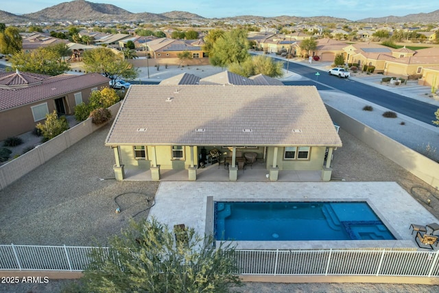 view of pool featuring a mountain view and a patio