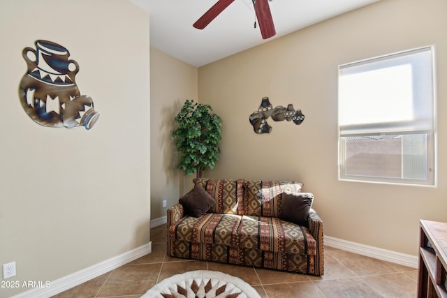 living area featuring light tile patterned flooring and ceiling fan