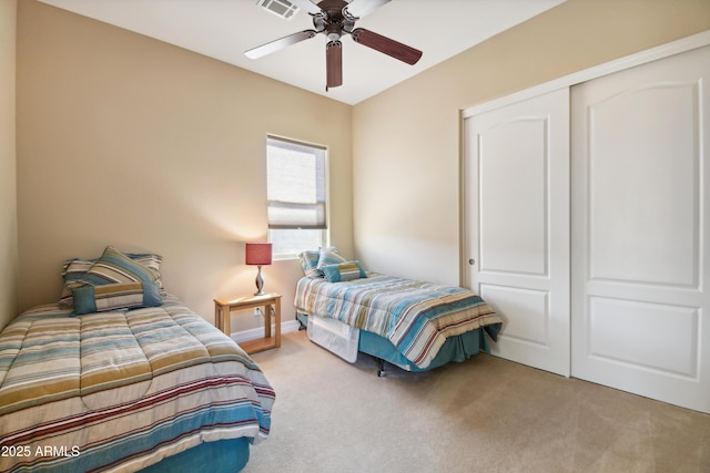 bedroom with ceiling fan, a closet, and carpet flooring