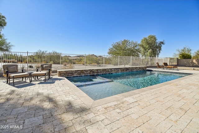 view of pool featuring a patio