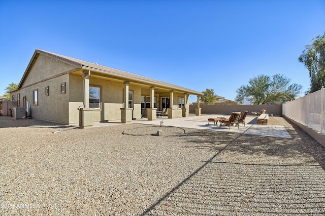 back of property with a patio area