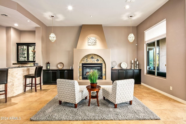 tiled living room with a tiled fireplace